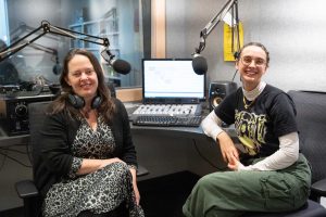 Creative Writing instructor Jennifer Moss and CiTR volunteer coordinator Dora Dubber (BA ’18) sitting inside a recording studio.