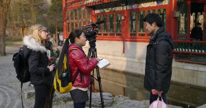A group of students conducting a video interview.