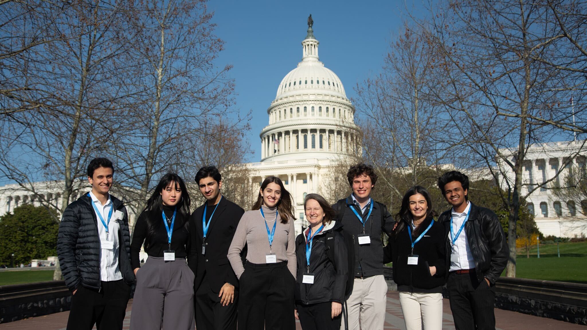 Photo of students and Dr. Peterson in Washington, D.C. for Scholars At Risk's Student Advocacy Days on March 2024. The students and Dr. Peterson and standing in front of the USA Capitol/
