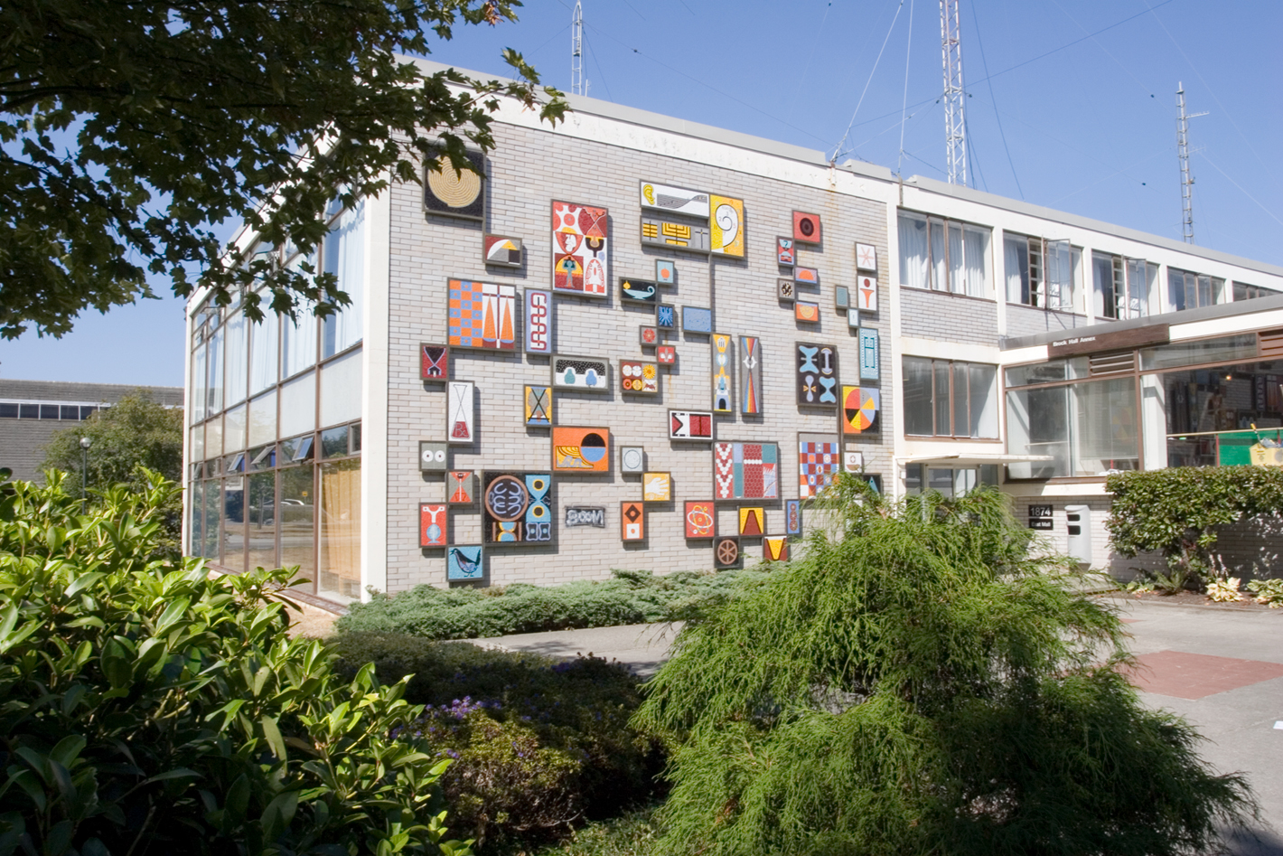 Lionel and Patricia Thomas' Symbols for Education mural in its previous placement outside UBC's Brock Hall Annex