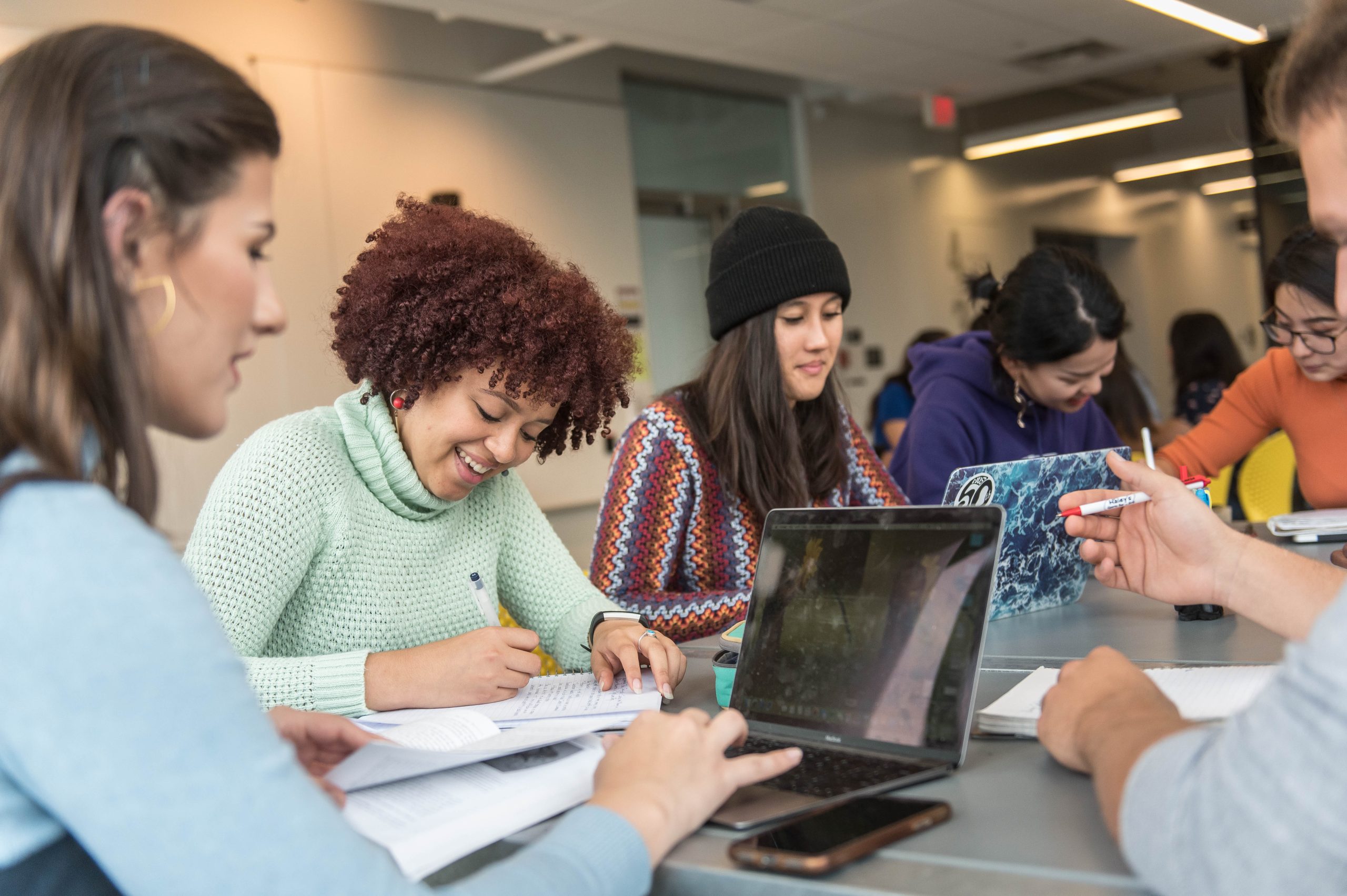 A group of students studying at a table.